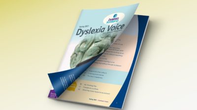 A copy of Dyslexia Voice magazine; the cover peels open to reveal the contents page.