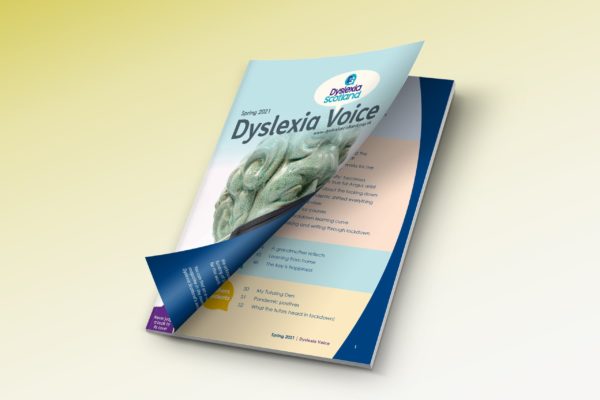 A copy of Dyslexia Voice magazine; the cover peels open to reveal the contents page.