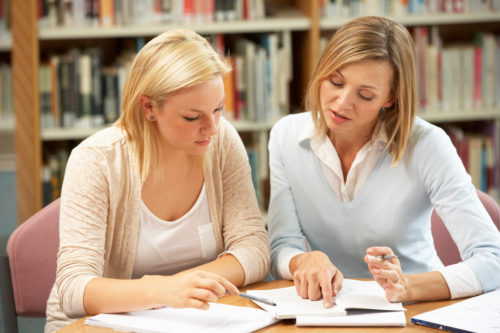 A dyslexia tutor working with an adult 