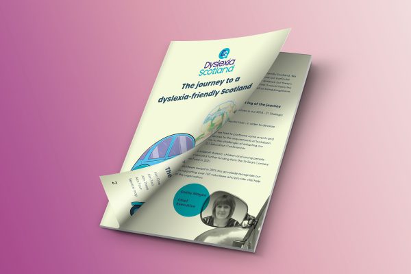 A4 booklet called The Journey to a Dyslexia-Friendly Scotland, the front cover peeling back to reveal an inner page of text.