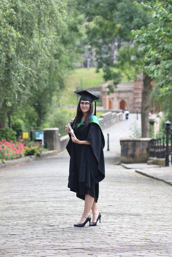 Katy Aktemel in graduation robes