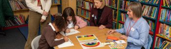Ms Connery and Jenny Gilruth MSP at a table with pupils