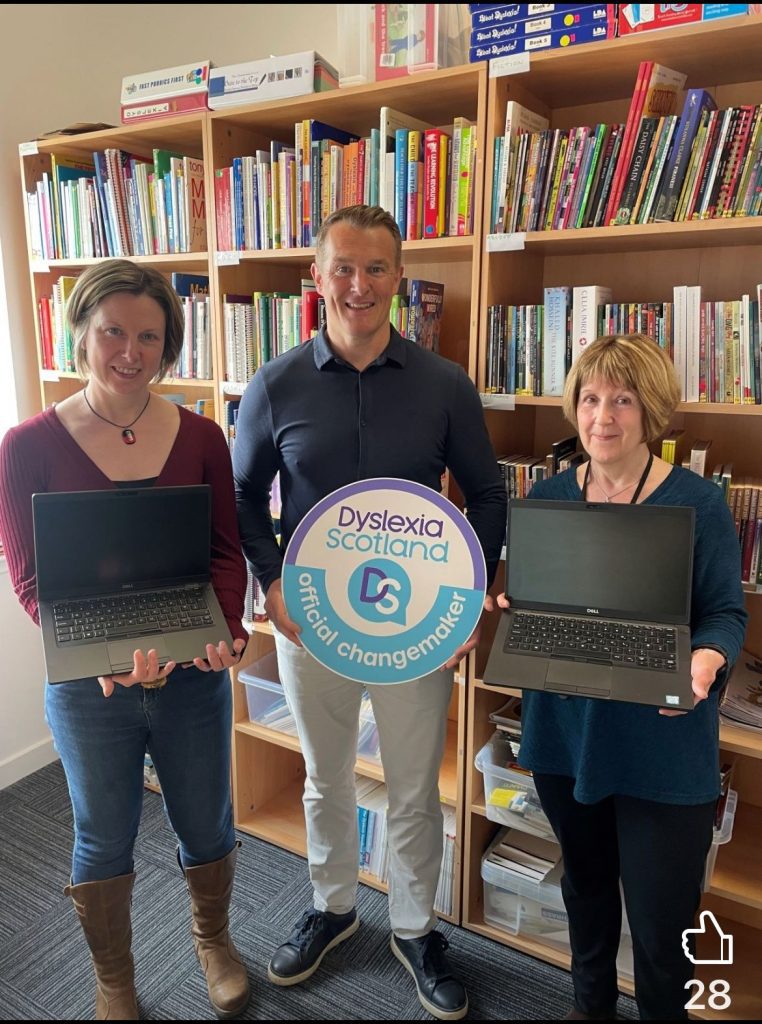 Dyslexia Scotland staff with the laptops