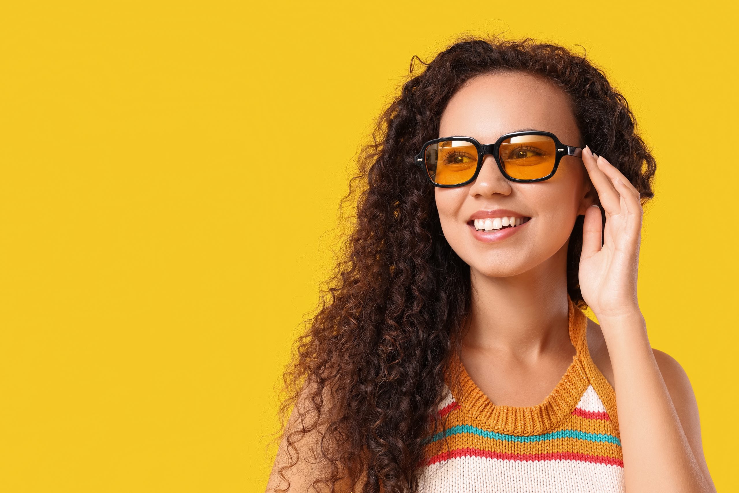 Woman wearing yellow-tinted glasses