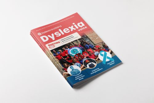 A stack of printed copies of the magazine