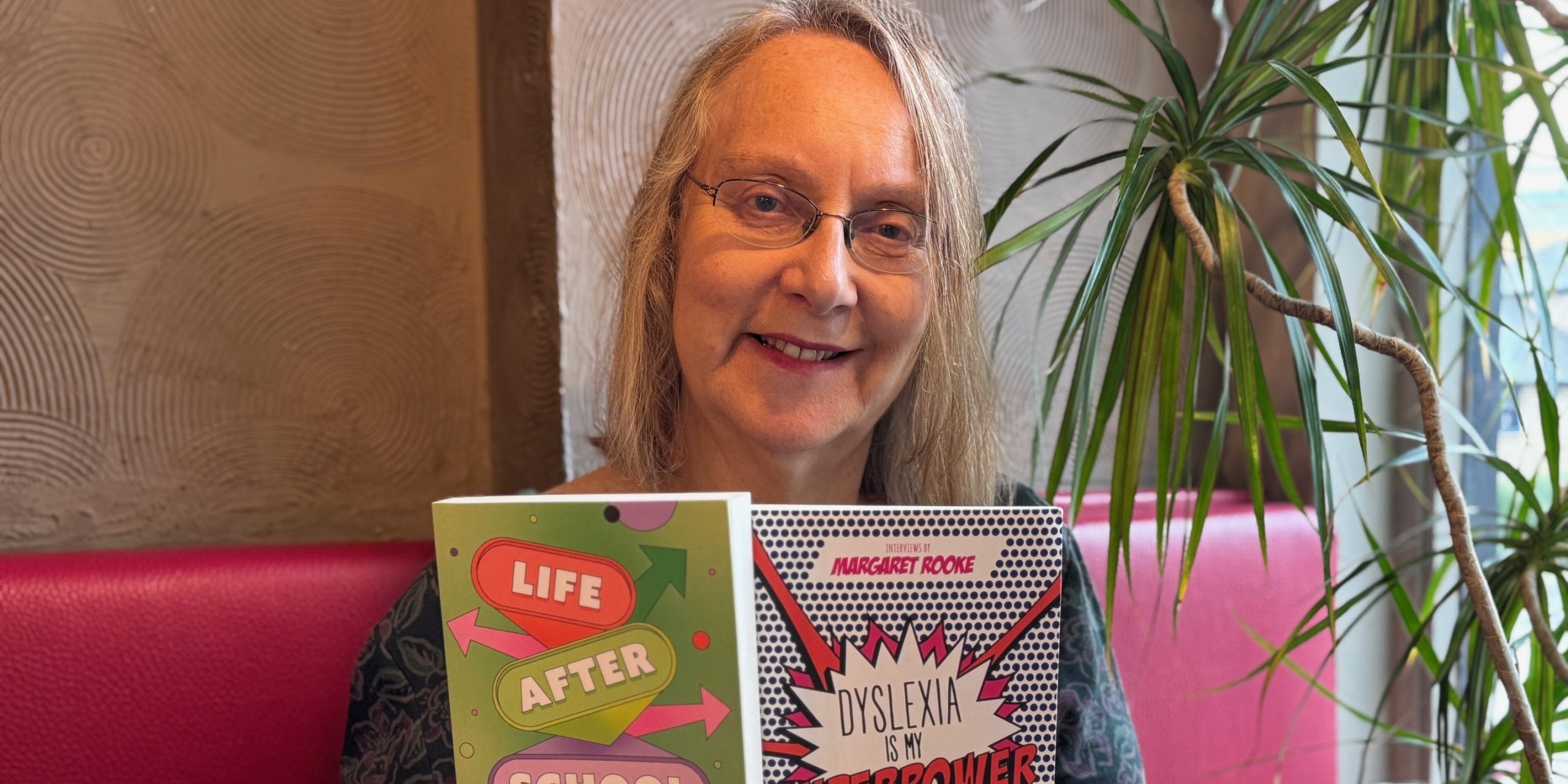 Margaret holds up her books