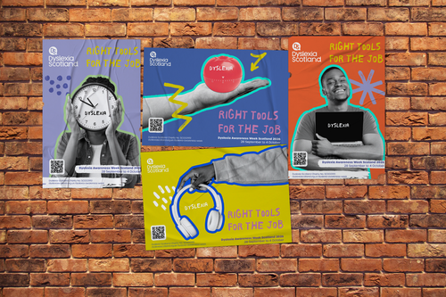 A brick wall with dyslexia awareness posters pasted on