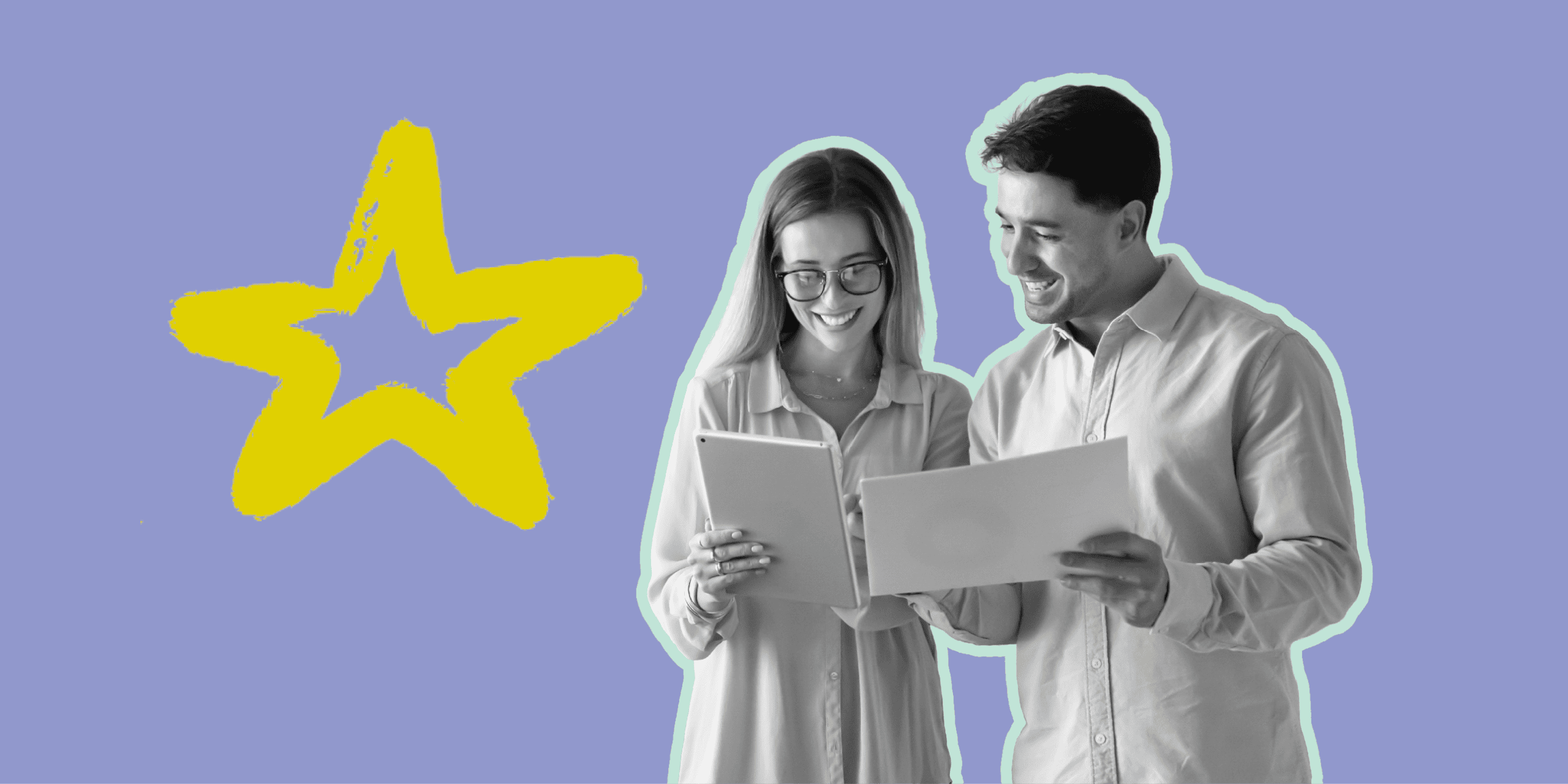 Co workers smiling as they review a document together